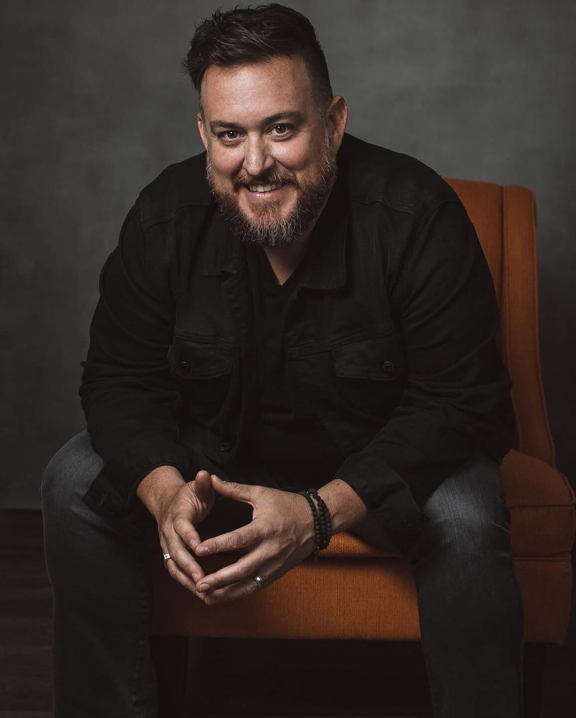 Shaun Gordon sitting on a chair, featured in his blog about overcoming burnout and building KISS Books.